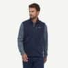 man in patagonia navy vest